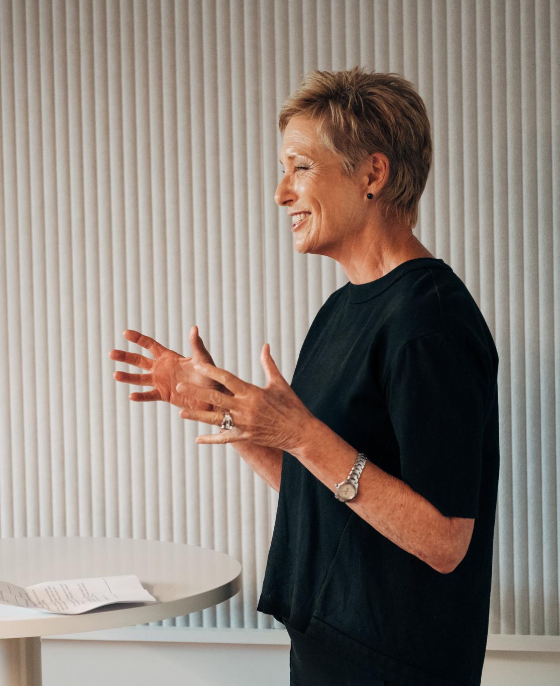 Dixie Marshall smiling and presenting at the Marketforce open office day.